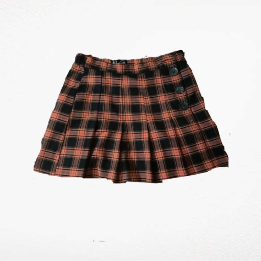 orange and black pleated plaid skirt